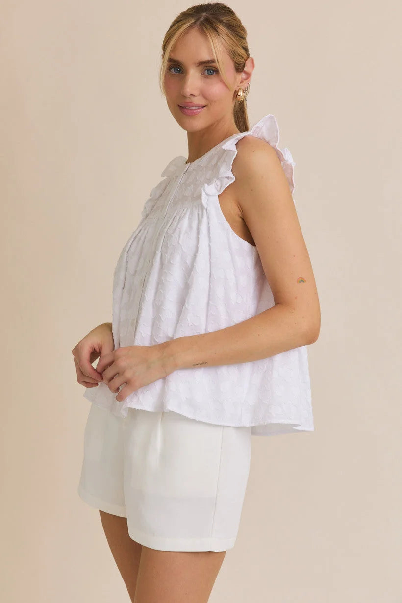 White round neck ruffle sleeveless top with ruffle sleeve button details and matching shorts