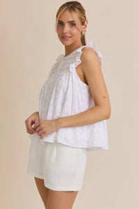 White round neck ruffle sleeveless top with ruffle sleeve button details and matching shorts