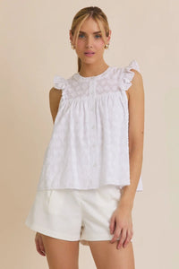 White sleeveless blouse with round neck ruffle and ruffle sleeve button details