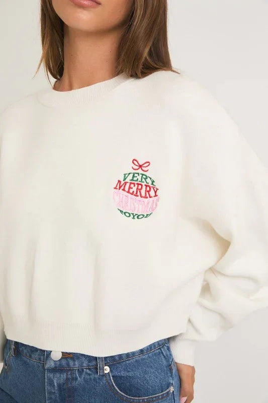 White sweatshirt featuring small embroidered Merry Christmas design, perfect for a round neck merry christmas style