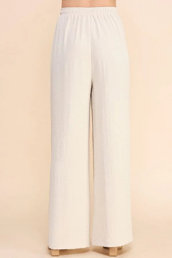 White wide-leg Airy Drawstring Pants with pockets and an elastic waistband
