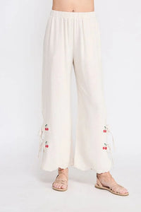 White linen elastic waist embroidered pants with cherry embroidery for a stylish look