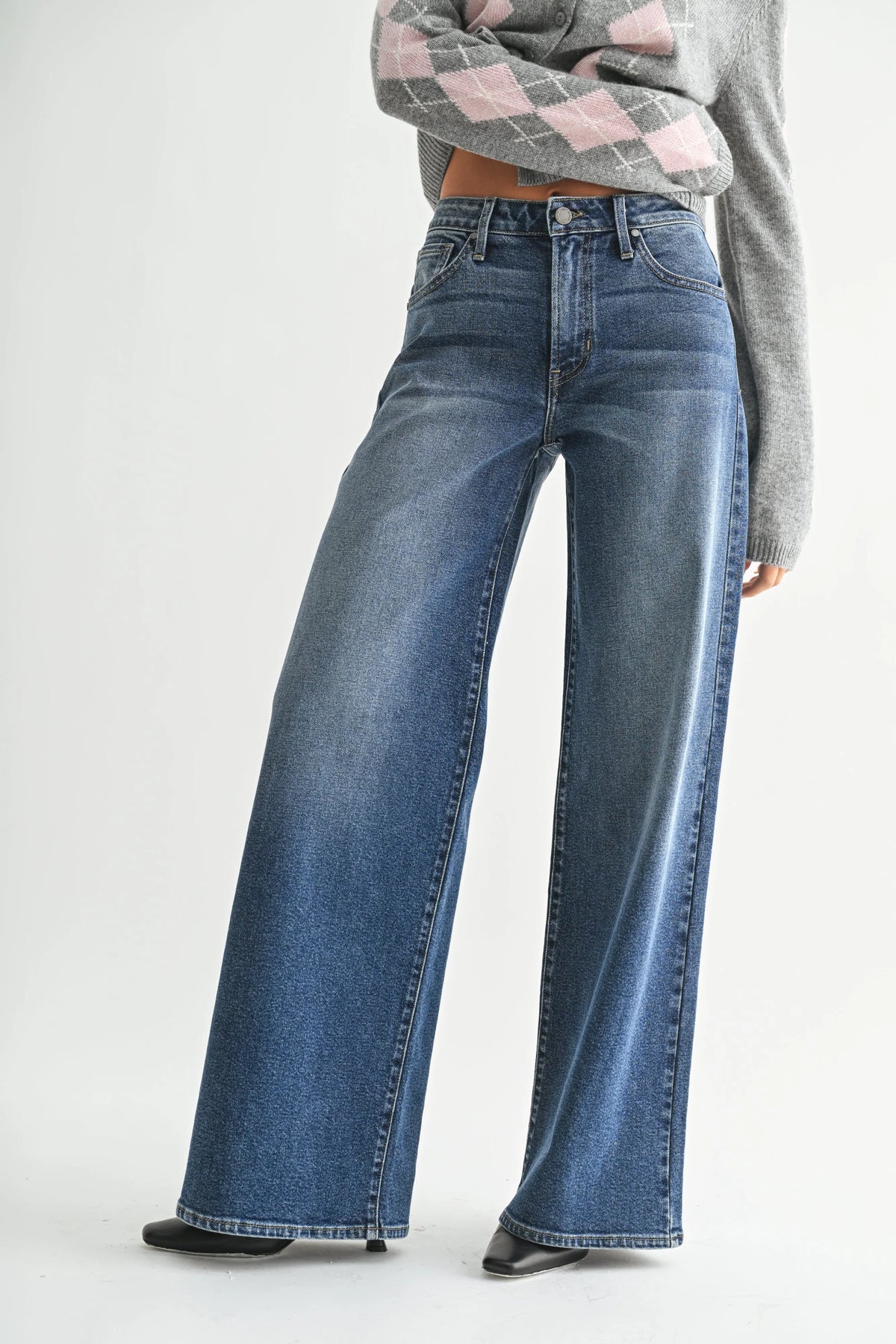 High-rise ultra wide-leg denim jeans showcasing bohemian style and wide-leg design