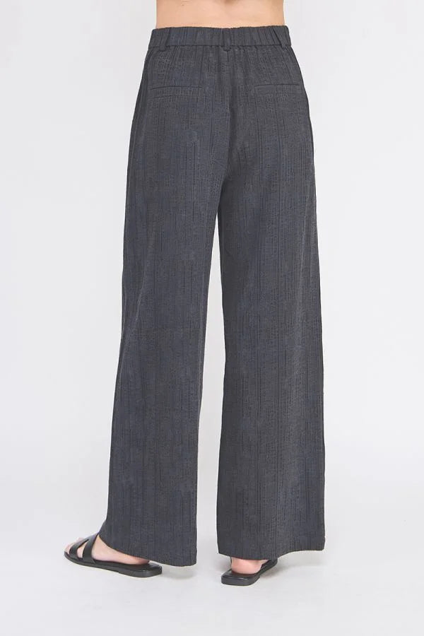 Textured wide leg pants with pinstripe design featuring back elastic waist