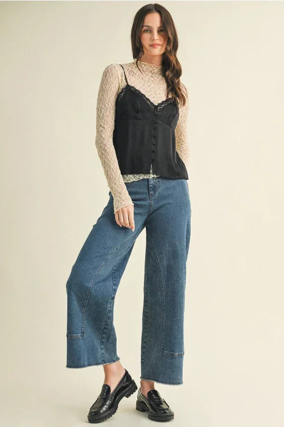 Women’s boho chic clothing featuring a lace v neck cami top styled over a sheer beige long-sleeve