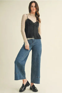 Women’s boho chic clothing featuring a lace v neck cami top styled over a sheer beige long-sleeve