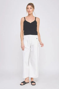 Woman wearing COTTON ELASTIC BACK WAIST PANTS with stretchy waistband and accent buttons