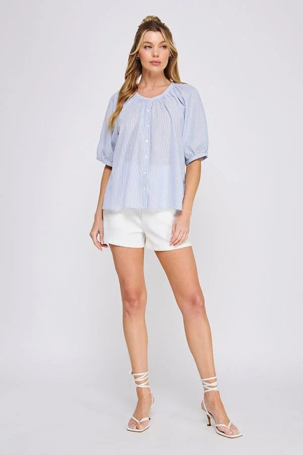 Woman wearing Daisy Lane’s striped seersucker rayon-linen blend short sleeve blouse