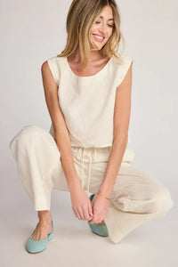 Woman wearing SUNDAY RITUAL ELENA TOP in cream linen, perfect for women’s boho chic clothing