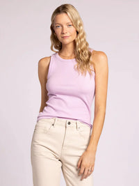 Woman wearing EDLIN BASIC TANK in lavender with beige pants, showcasing casual style