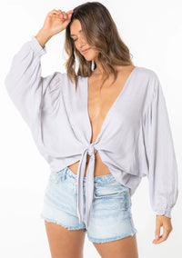 Woman wearing Jacquard Stripe Long Sleeve Kimono Top with light wash denim shorts