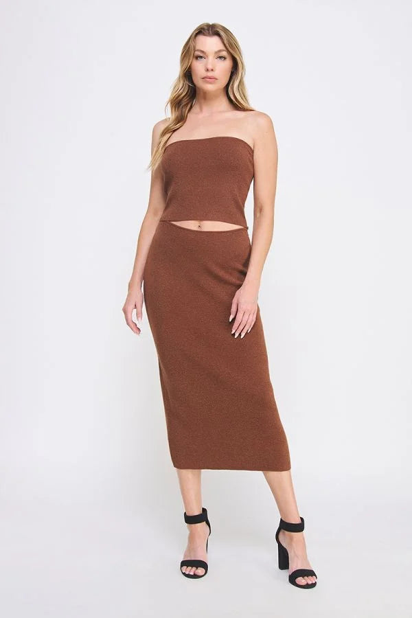 Woman modeling soft lurex tube midi skirt with strapless crop top and black heels