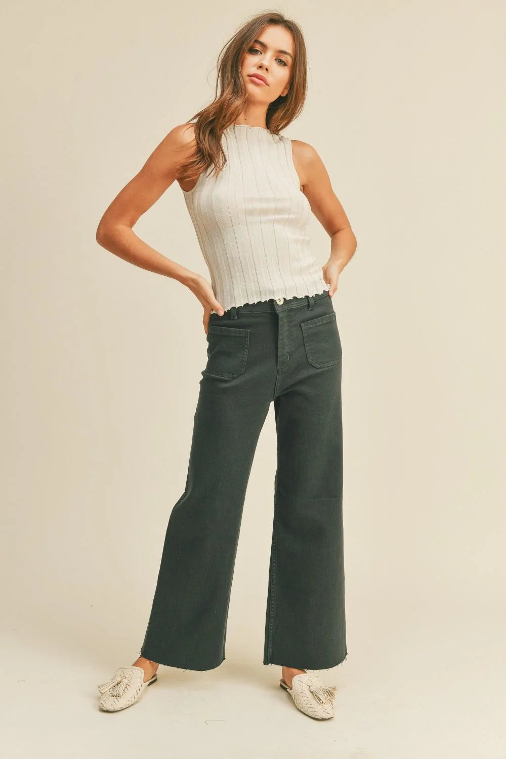 Woman in stylish wide leg denim pants with front pockets from Daisy Lane collection