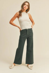 Woman in stylish wide leg denim pants with front pockets from Daisy Lane collection