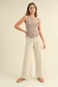 Woman wearing stylish wide leg denim pants with front pockets from Daisy Lane