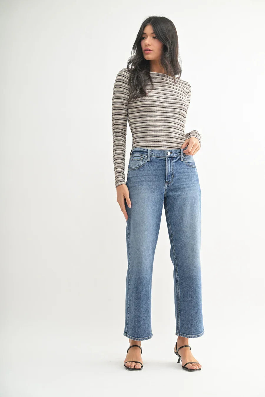 Woman in striped long-sleeve shirt and blue jeans featuring Mid Rise Stretch Bow Boyfriend