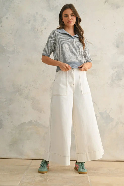 Woman wearing striped polo shirt and wide-leg pants in womenās boho chic clothing style