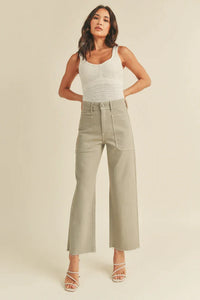 Woman in a white tank top and wide pants showcasing Nautical Wide Leg Denim