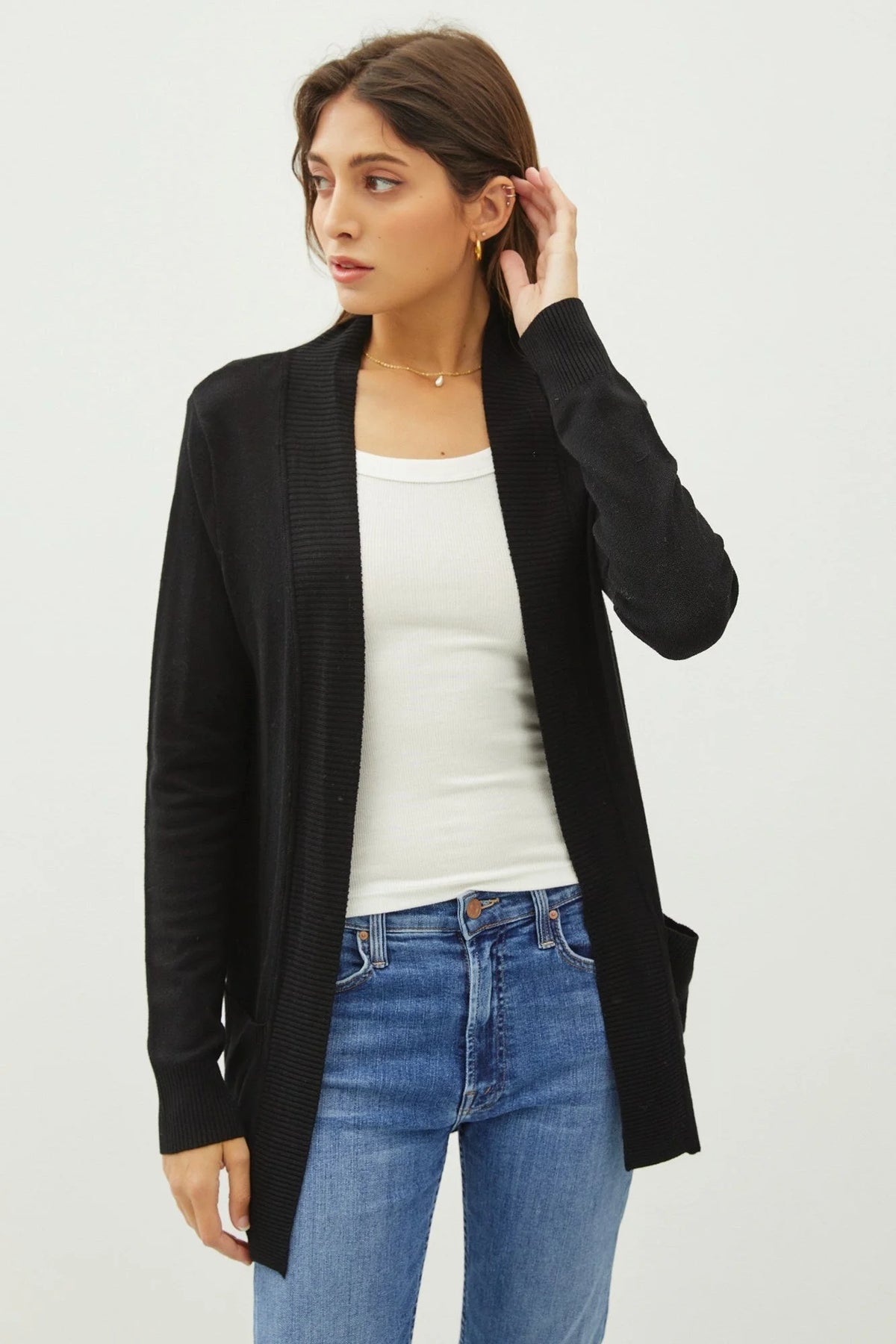 Woman wearing a black cotton blend knit open front cardigan from COTTON BLEND KNIT OPEN CARDIGAN collection
