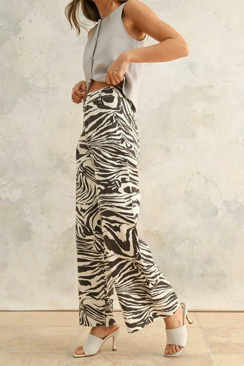 Woman wearing black and white zebra print stretch wide-leg pants, Zebra Print Stretch Pants