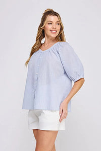 Woman’s blue striped seersucker blouse from Daisy Lane’s striped seersucker rayon-linen blend
