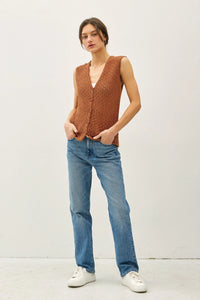 Woman’s brown knit vest and blue jeans outfit, ideal for women’s boho chic clothing from Shop Daisy