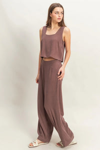 Woman in brown wide cut two-piece boho chic clothing set from Shop Daisy