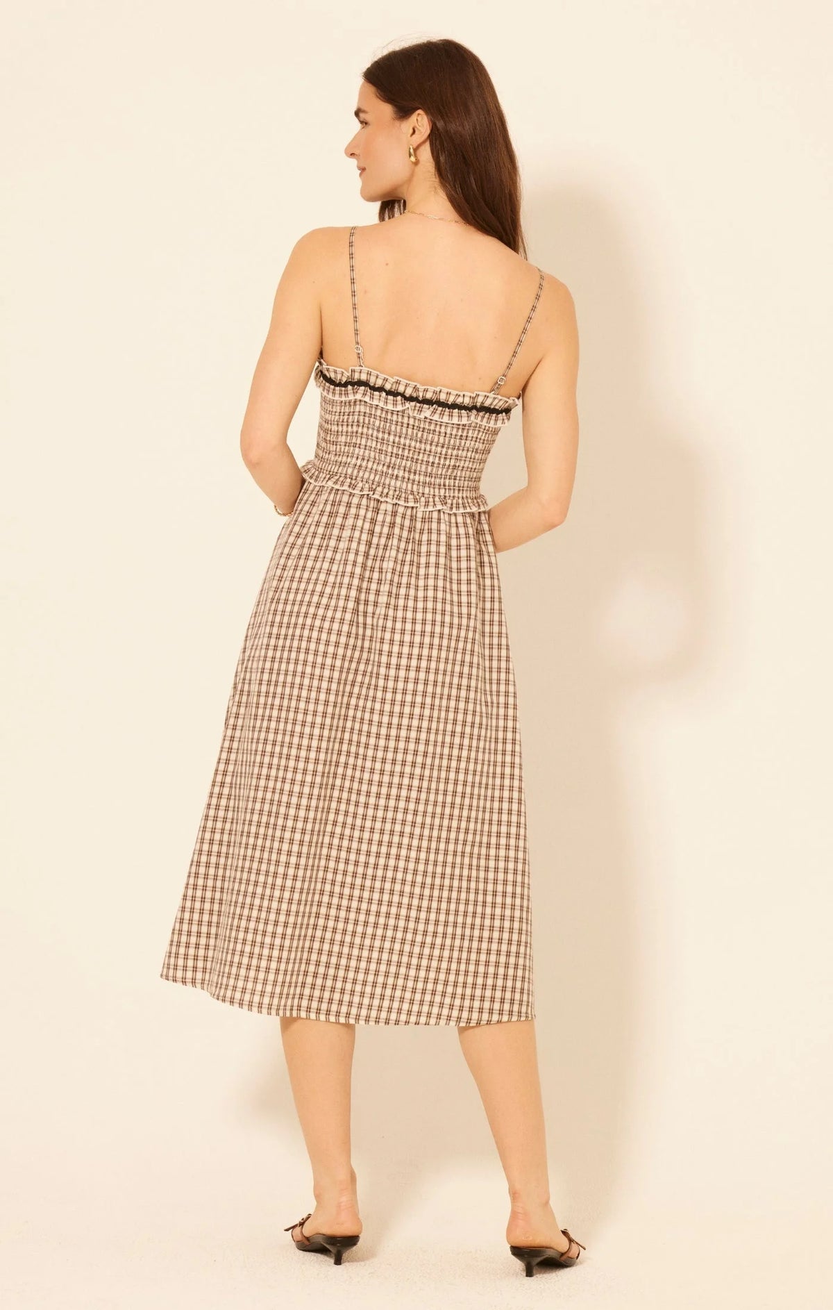 Woman wearing Aspen Plaid Midi Dress with spaghetti straps and shirred bodice