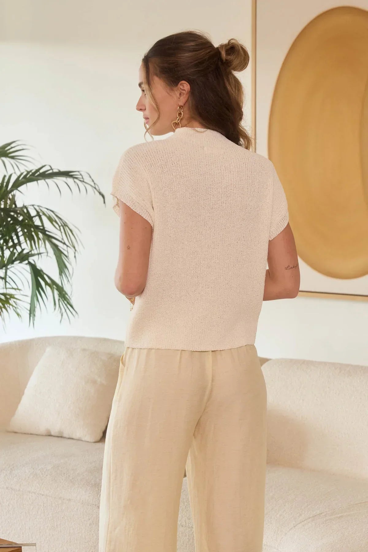 Woman’s cream knit top and pants from MOCK NECK SHORT SLEEVE POCKET DETAIL SWEATER TOP, ideal for women’s boho chic clothing