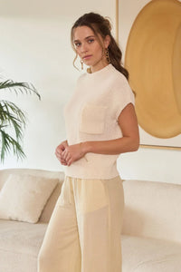 Women’s cream-colored knitwear set from MOCK NECK SHORT SLEEVE POCKET DETAIL SWEATER TOP, ideal for women’s boho chic clothing from Shop Daisy