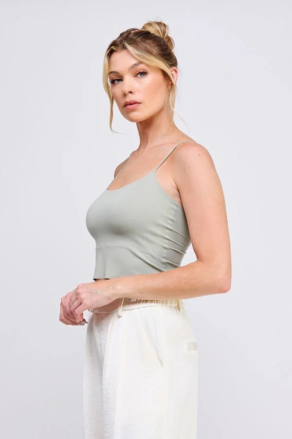 Woman wearing a smooth rib bralette with laser cut tank back detail