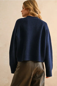 Dark blue women’s boho chic clothing featuring York letter front sweater from Shop Daisy