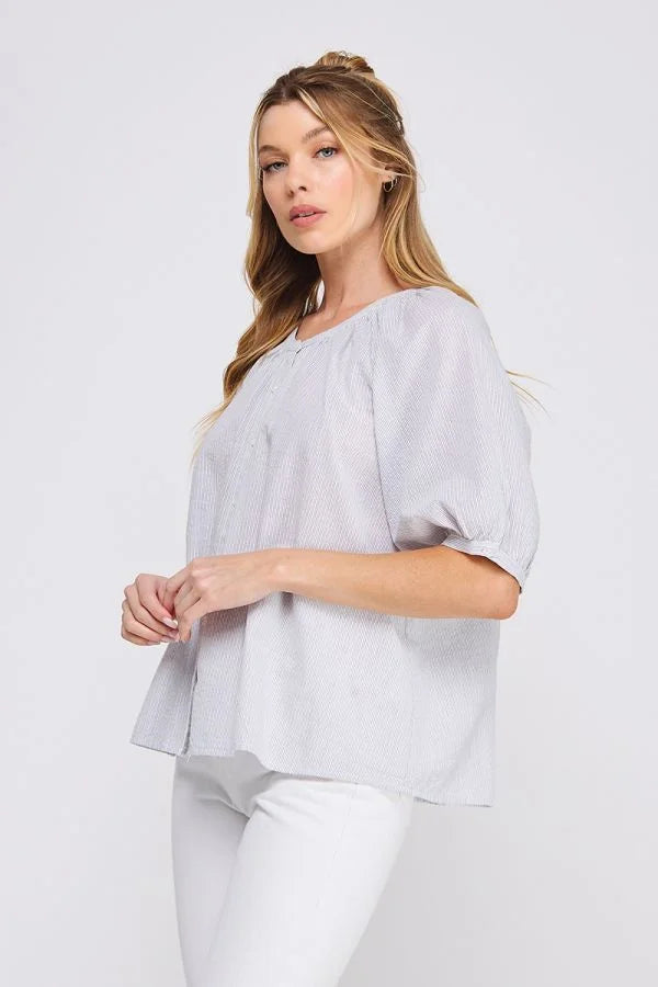 Woman’s light gray striped seersucker blouse from Daisy Lane’s striped seersucker rayon-linen blend