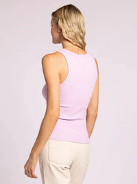 Woman in a lilac ribbed tank top wearing the Edlin Basic Tank for a stylish look