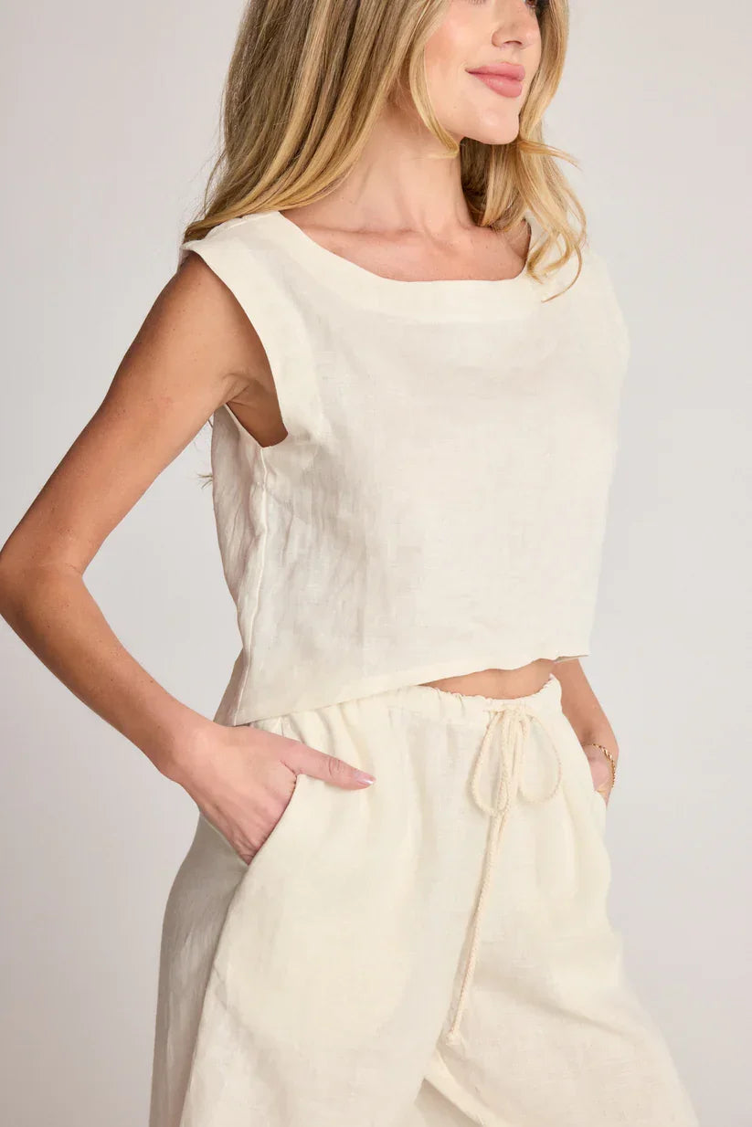 Woman wearing SUNDAY RITUAL ELENA TOP linen crop top and pants set, perfect women’s boho chic clothing from Shop Daisy