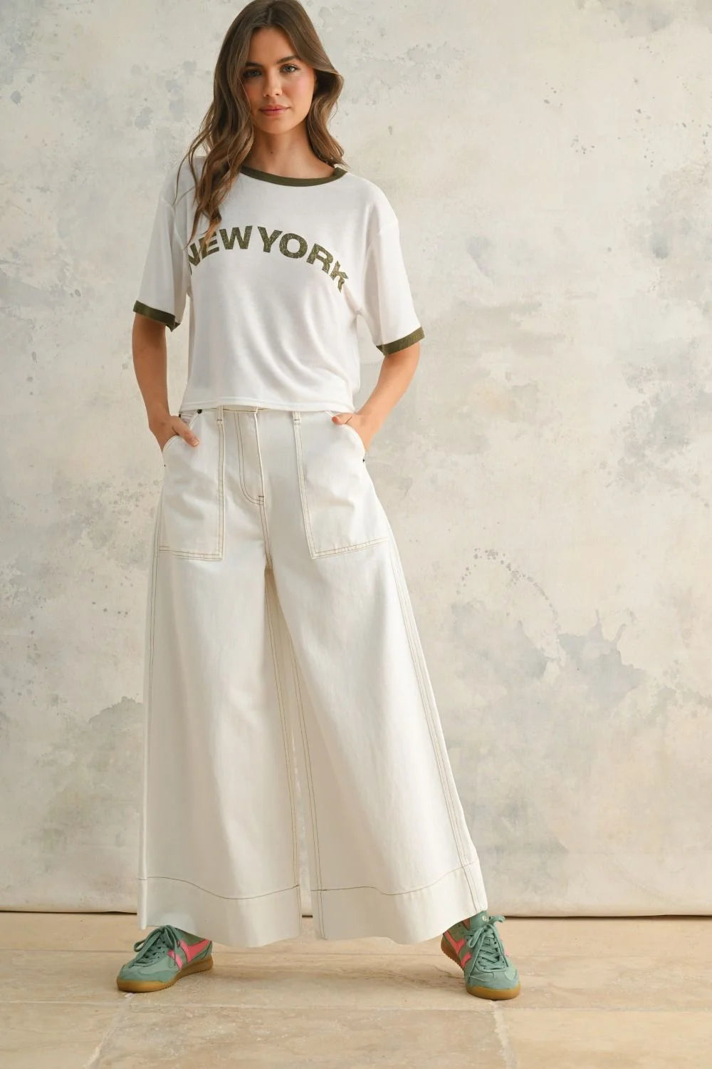 Woman’s white New York t-shirt and wide-leg pants outfit showcasing women’s boho chic clothing