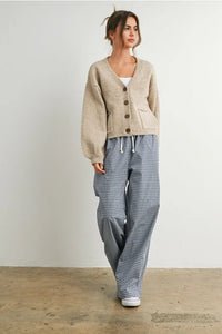 Women’s beige V neck cuff button-up long sleeve cardigan with front pockets