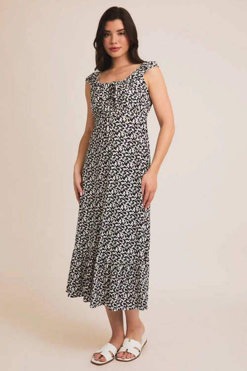 Womenās black and white abstract print midi dress with tie cap sleeves and ruffled straps