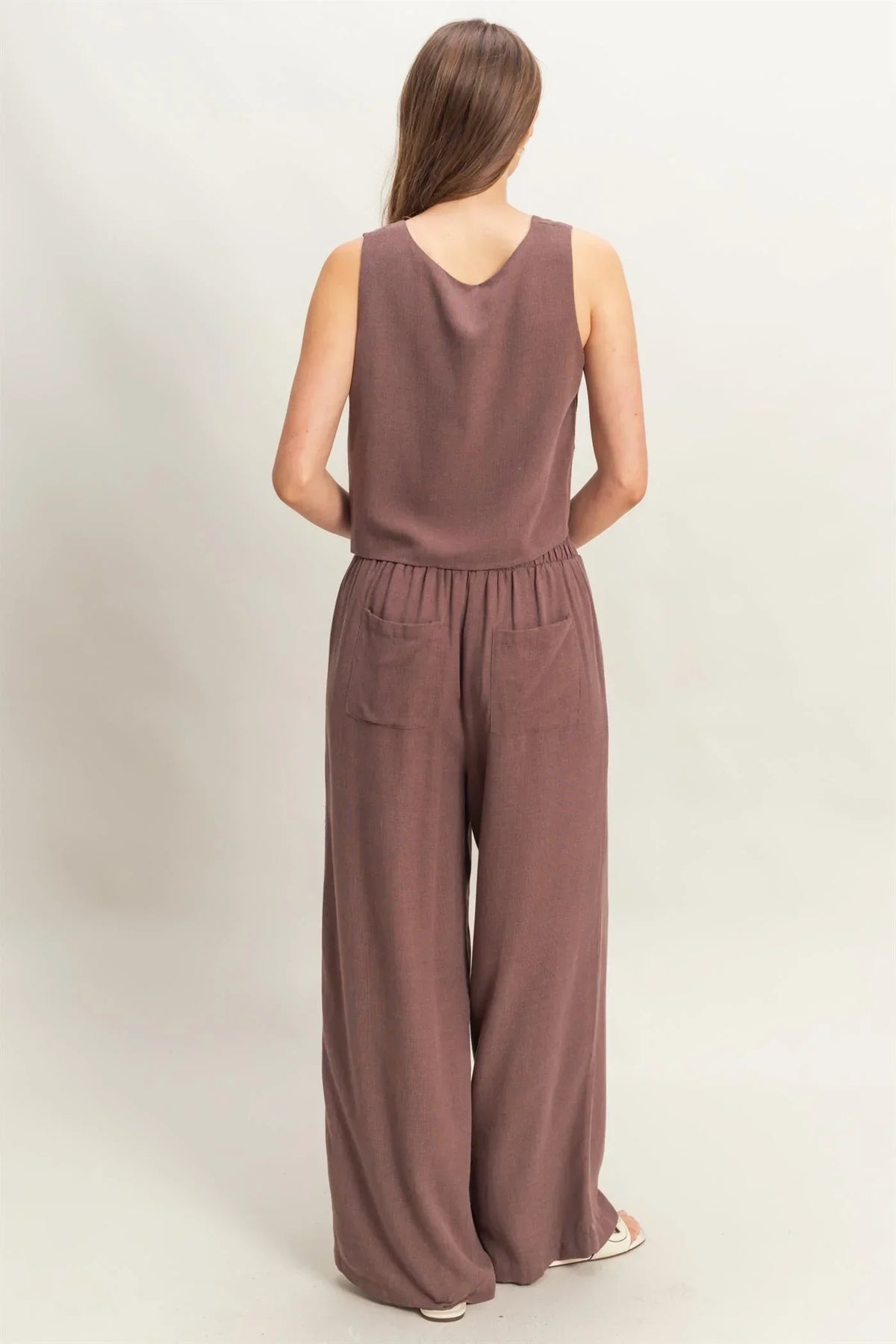 Women’s brown sleeveless jumpsuit with wide cut, perfect for women’s boho chic clothing from Shop Daisy