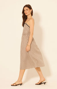 Women’s Aspen Plaid Midi Dress with brown and white gingham pattern, black trim, and spaghetti straps