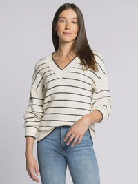 Women’s cream-colored V-neck supply IRA sweater with black horizontal stripes