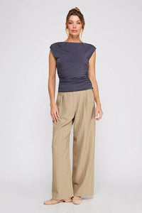 Women’s dark grey sleeveless boat neck scrunch tank top with wide-leg khaki pants