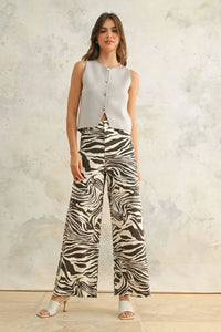 Women’s gray sleeveless top and zebra print stretch pants showcasing stylish zebra print stretch pants