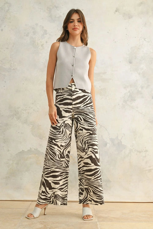 Womenās gray sleeveless top and zebra print stretch pants showcasing stylish zebra print stretch pants