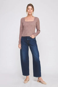 Women’s light brown long-sleeve top with lace square neck, paired with dark blue wide-leg jeans and beige slingback flats