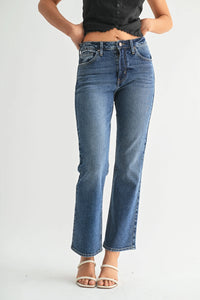 Women’s mid-wash blue denim flare jeans in high rise slim cropped style