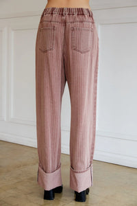 Women’s pink wide leg strip denim pants with elastic waist and cuffed hems