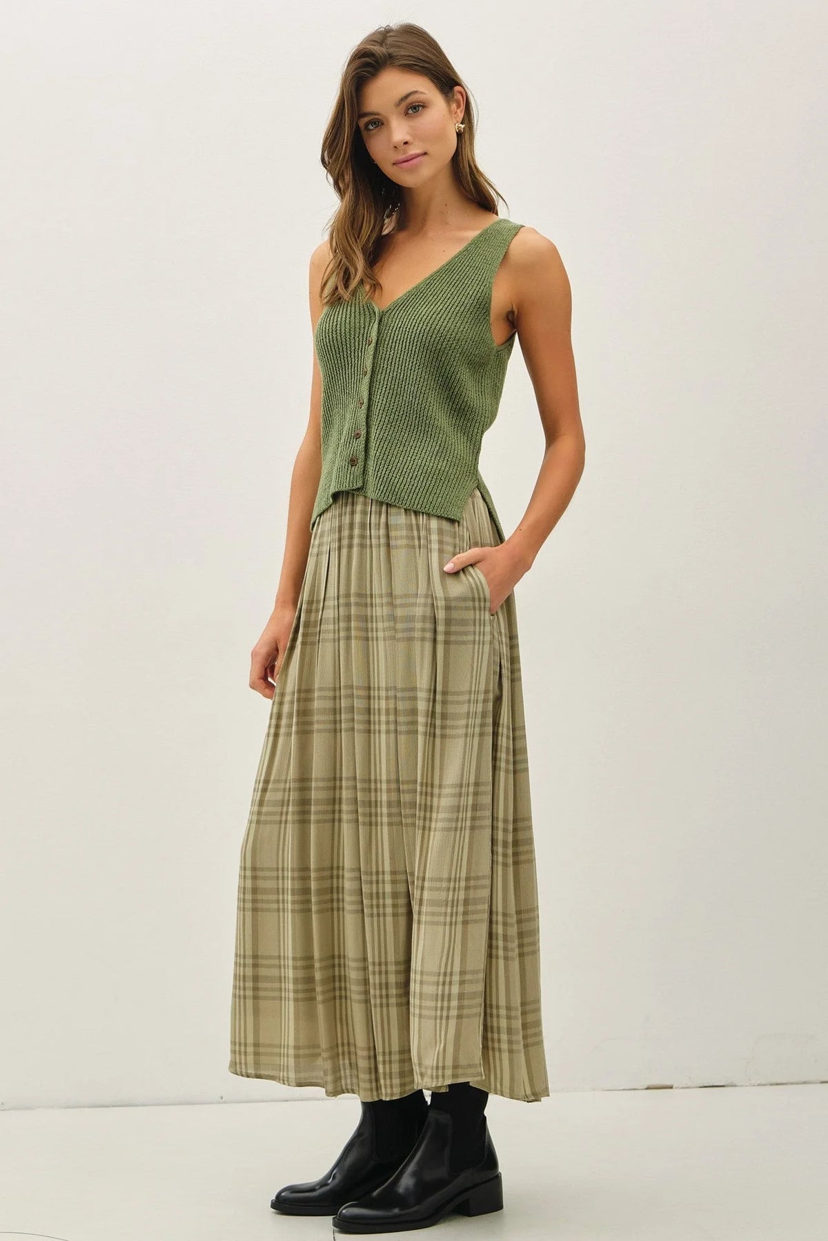 Women’s olive green sleeveless ribbed knit V-neck top with plaid printed pleats midi skirt