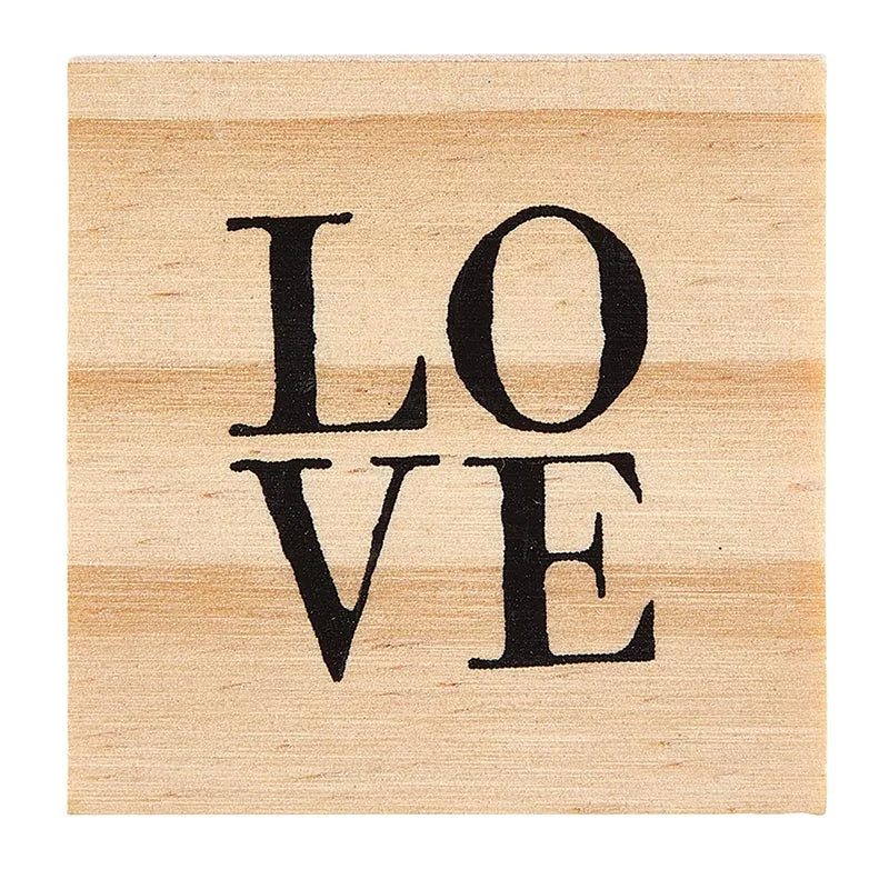 Wooden block with LOVE print featured in Treasure Box Earrings collection