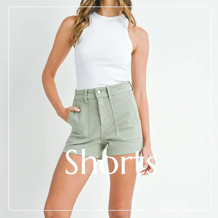 High-waisted sage green bohemian shorts with a white sleeveless top in Women Shorts Collection.